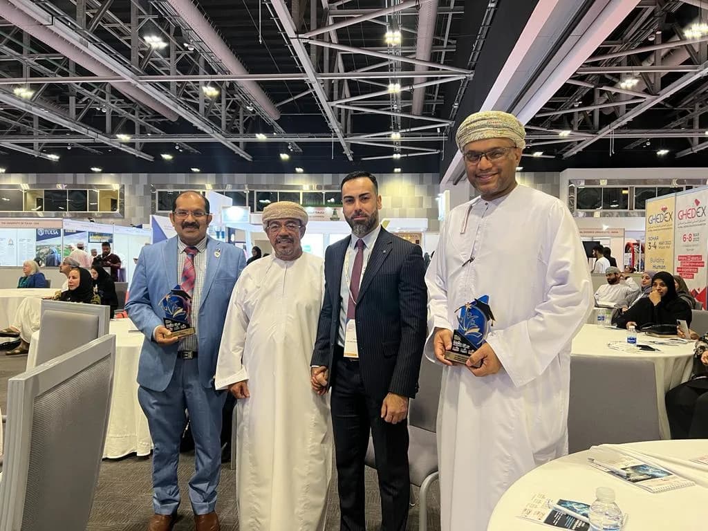 Dr. Alex Jones with delegates at an international education conference in the Gulf